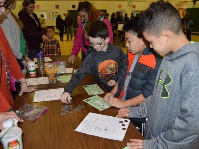 Students learning more about money with this thrilling game.