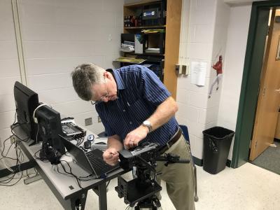 Mr.-Hyer-from-FCPS-IT-sets-up-new-equipment.